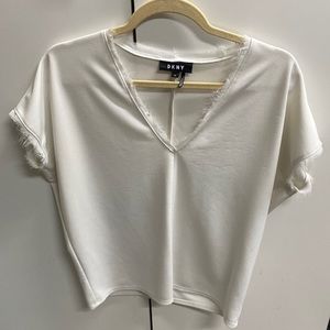 White v neck shirt with fringe hem detailing